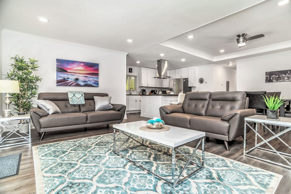 Open Space - Living Room with TV, electric fireplace & side Porch access