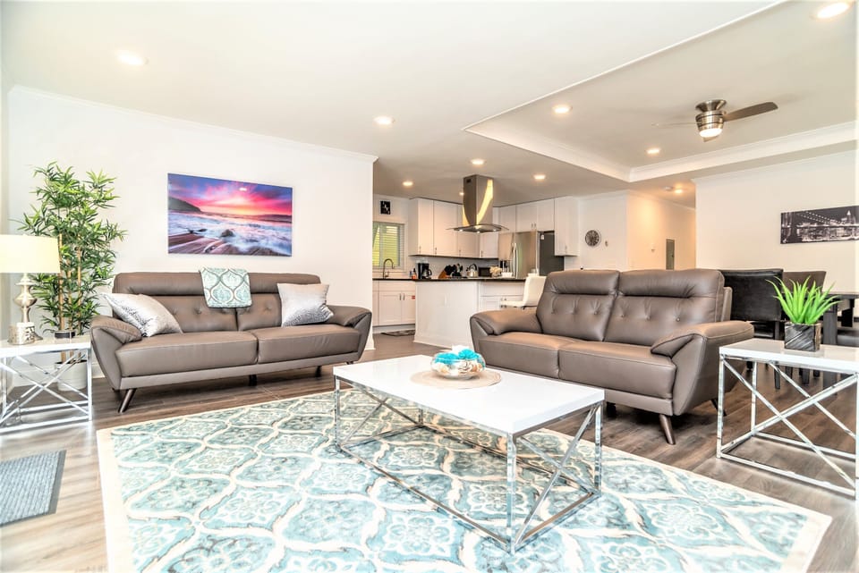 Open Space - Living Room with TV, electric fireplace & side Porch access