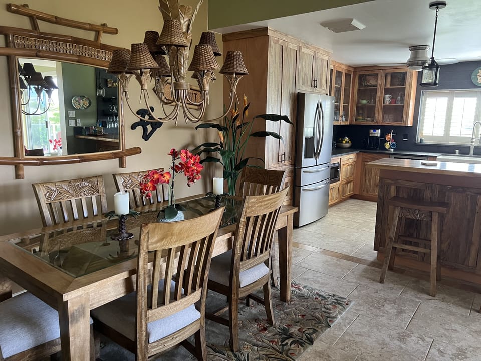 Mango dining room furniture looking into kitchen

