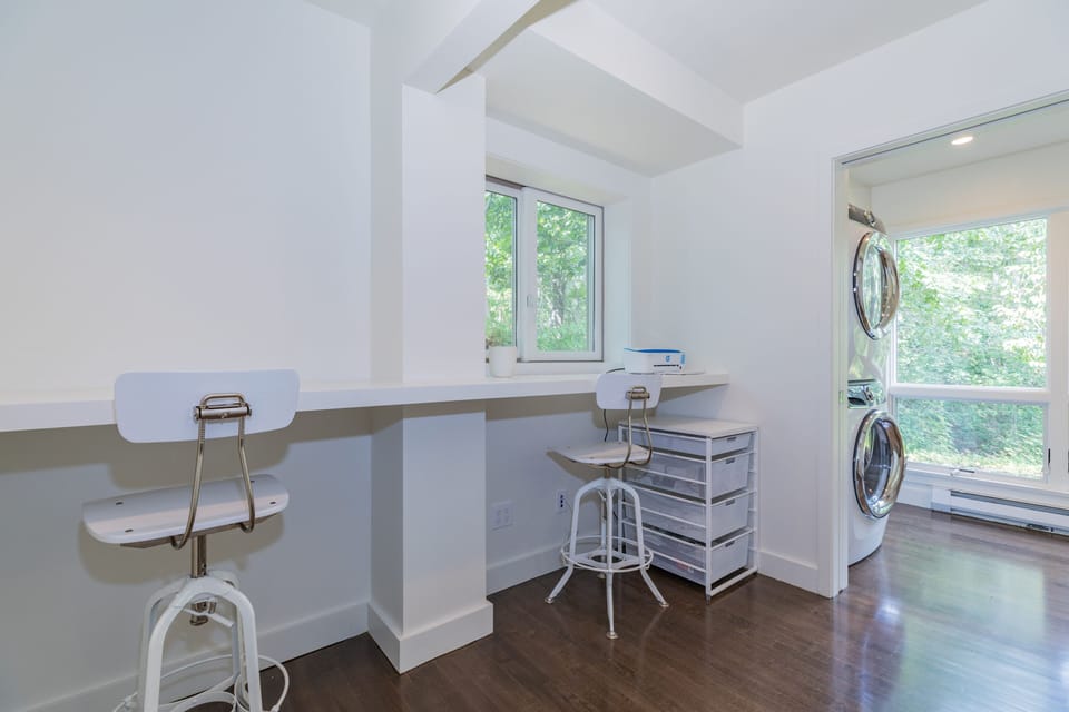 Dedicated office space features a charging station and printer.