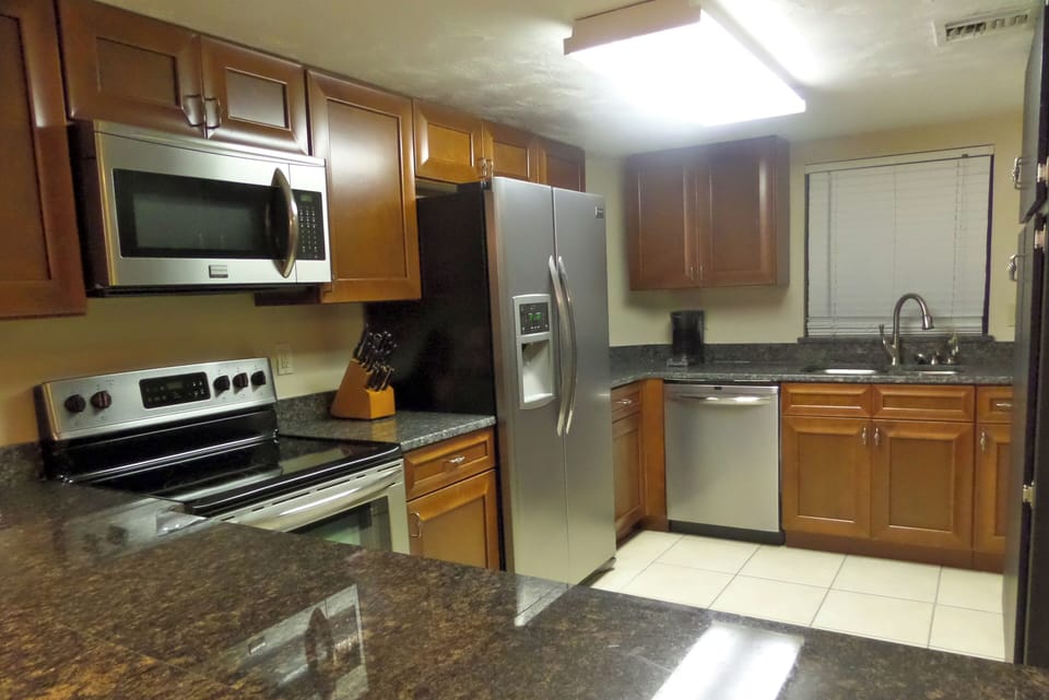 Our newly renovated kitchen with breakfast bar.