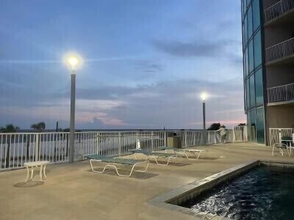 SECOND POOL AT NIGHT…EAST FACING AND STEPS FROM OUR #202 & #203 UNITS