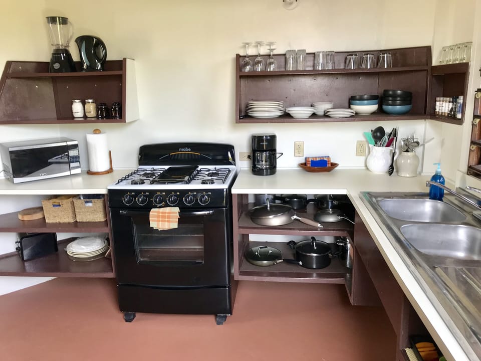 A fully equipped clean kitchen with all the amenities.