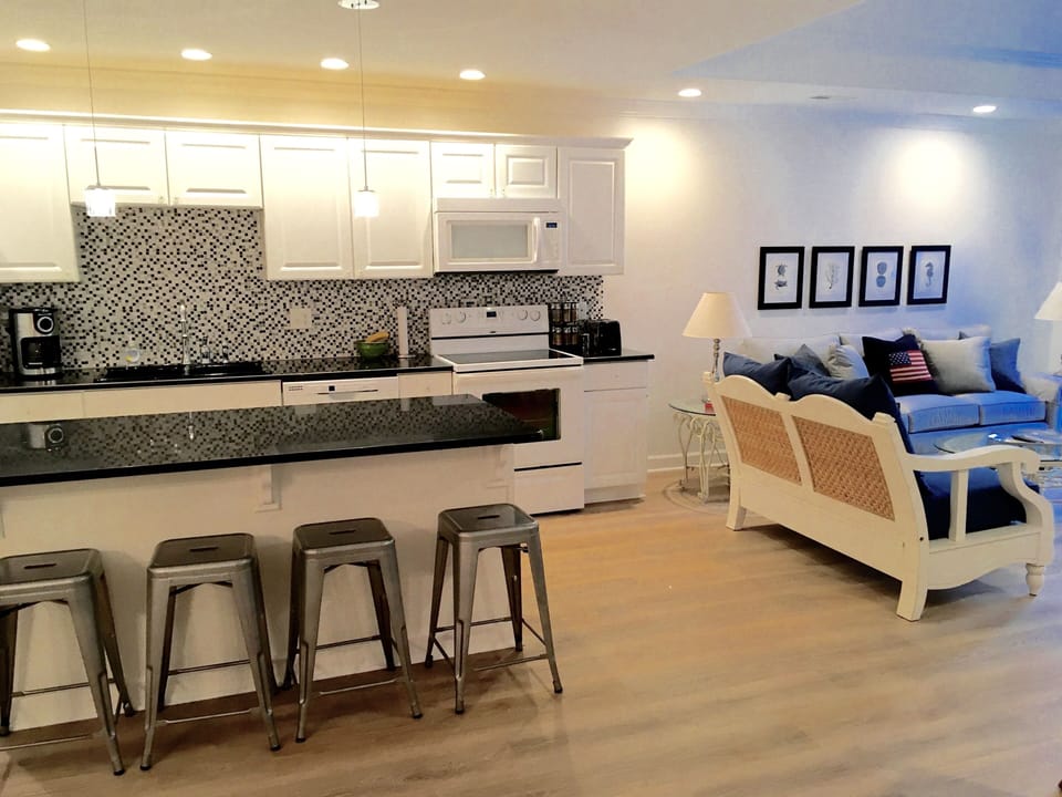 Island in the kitchen makes cooking very social during your vacation.
