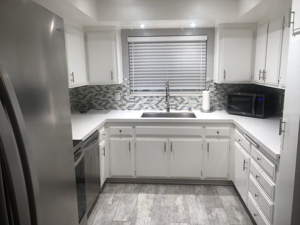 Nicely remodeled kitchen with large stainless steel sink & newer appliances 