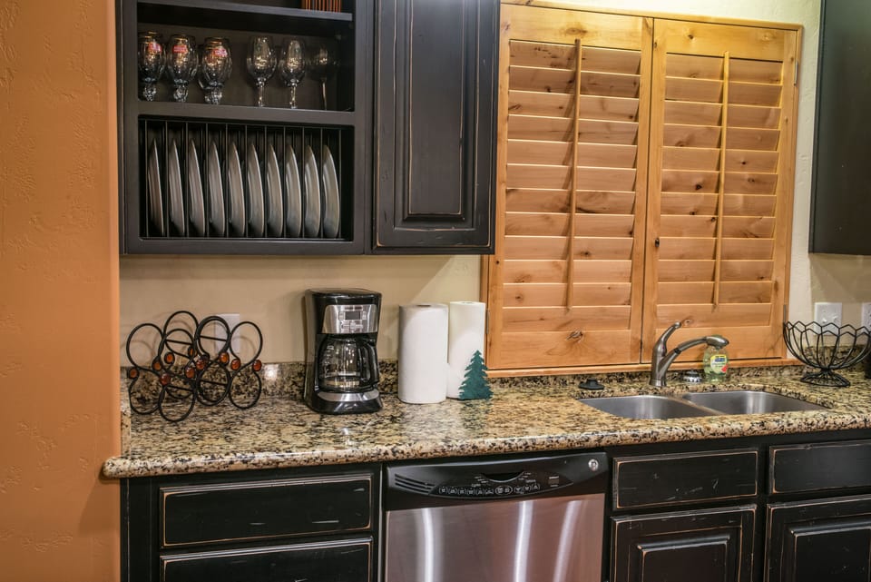 Kitchen- Great china and stemware in this home. this home even has a dishwasher!