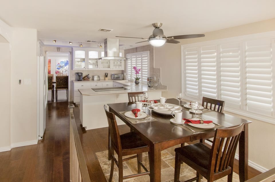 Breakfast nook seats 6. Open layout to Kitchen, Den with 70" LED TV and Wet Bar