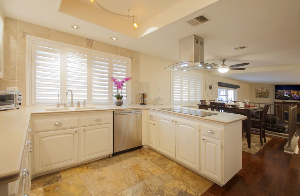 Bright Kitchen open to Nook and Den with Wet Bar, Beverage Center, 70" LED TV