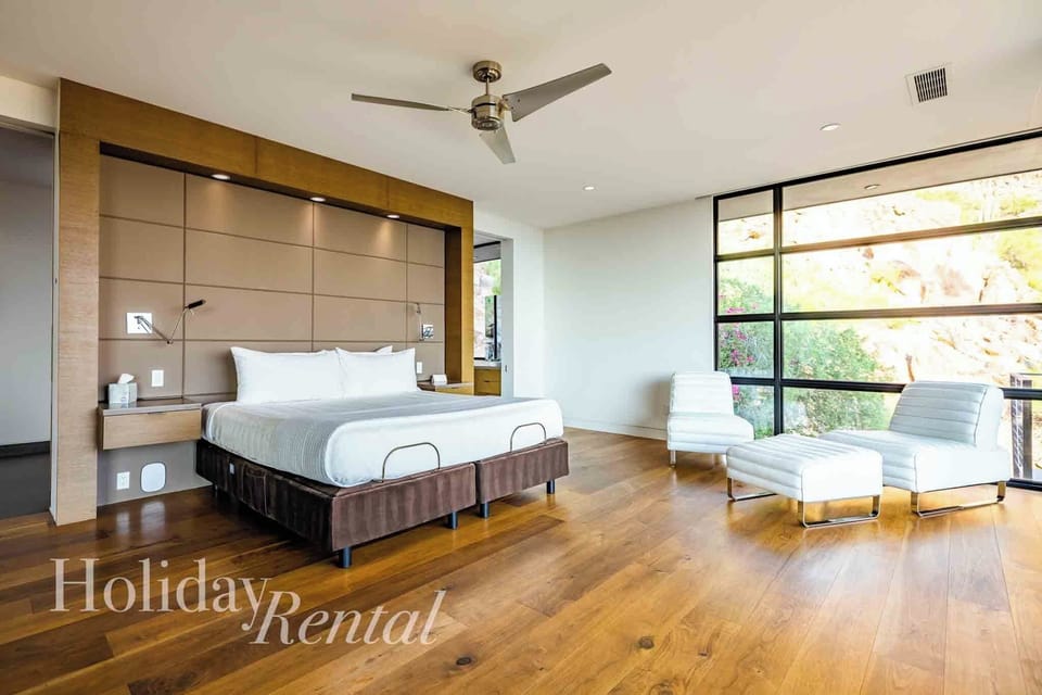 Tranquil king suite with en suite, seating area & stunning natural views.