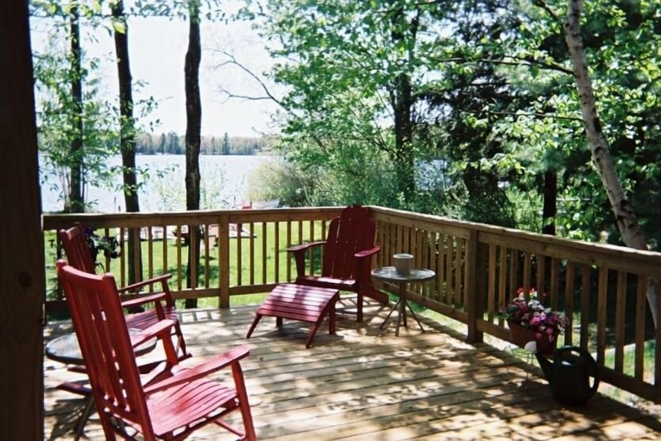 Beautiful deck overlooking patio, beach, and lake