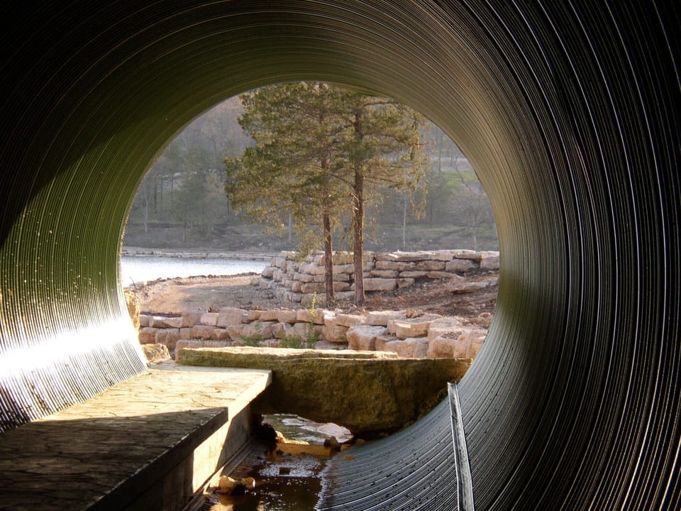 Fox Hollow Creek feeds the lake through this walking tunnel
