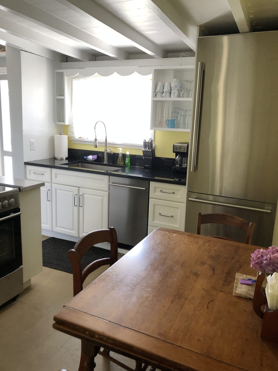 Kitchen with small dishwasher.