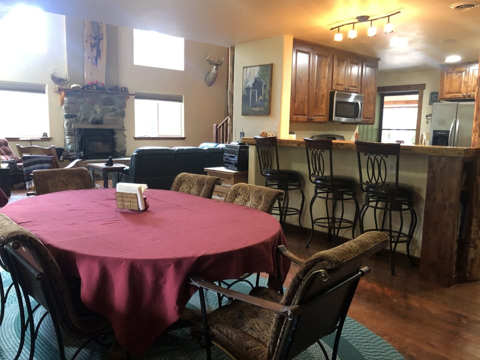 The dining table seats six or more, plus you have the bar, and subsidiary table.