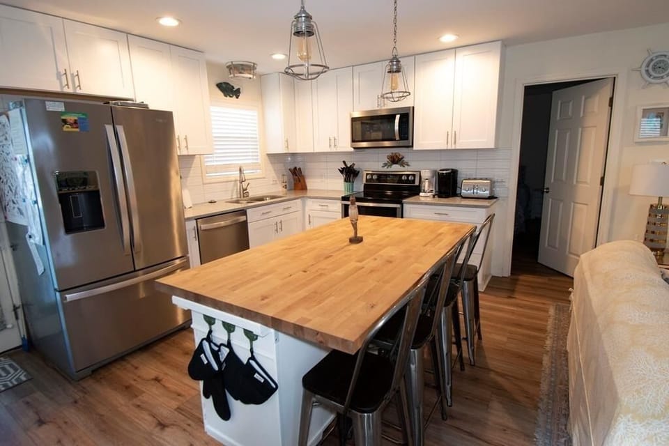 View of Kitchen and rear Master Bedroom door 