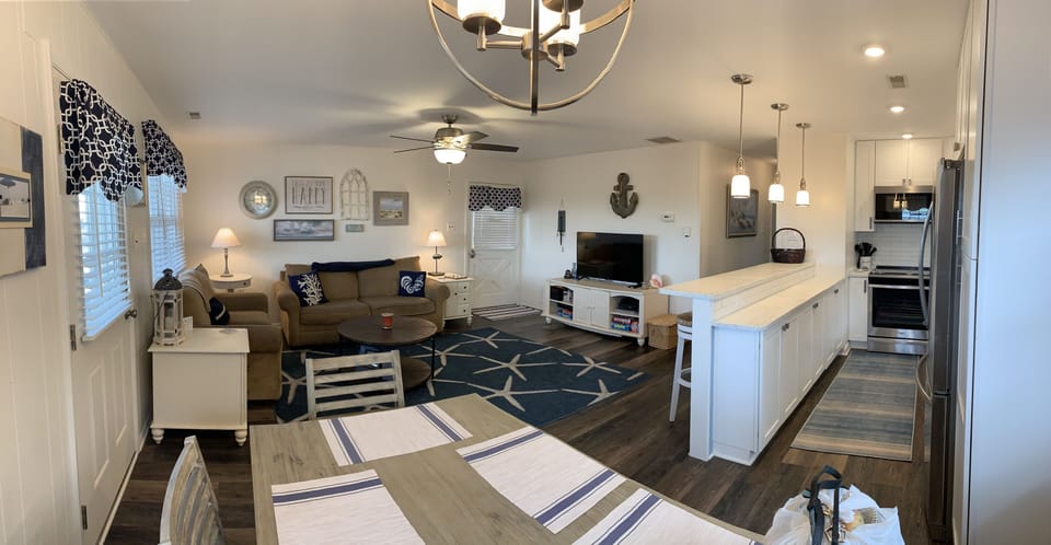 Seating for 4 at the island and 6+ at table (sofas replaced since this pic)