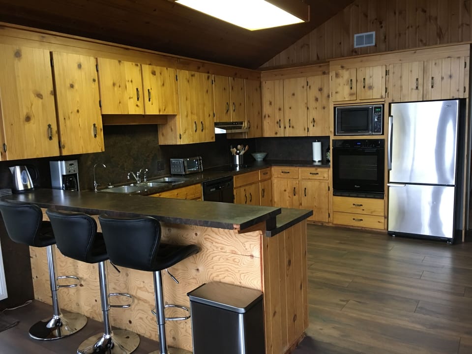 Kitchen with bar stools breakfast area