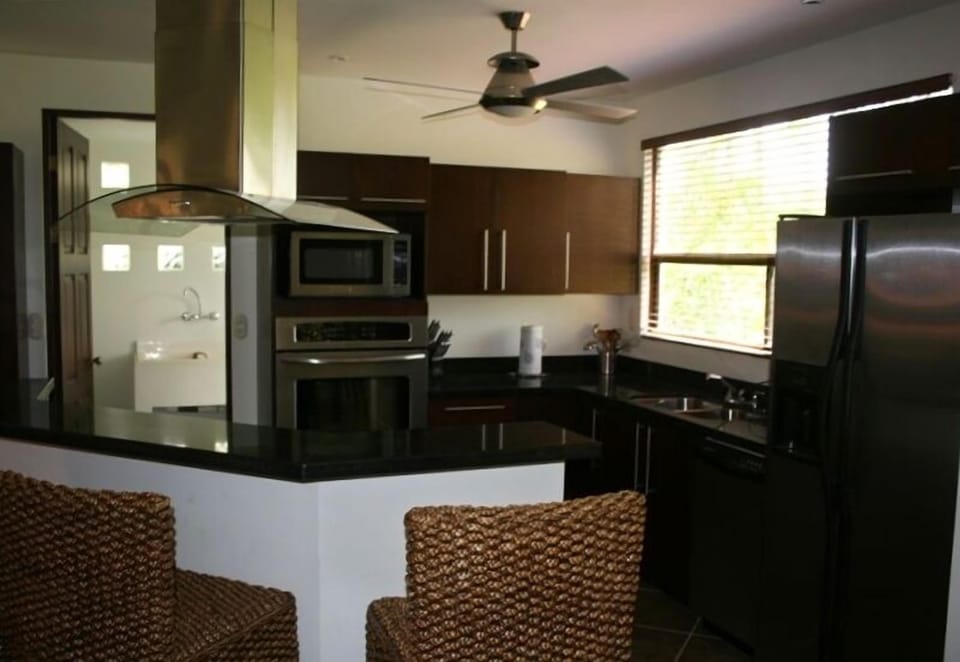 gourmet kitchen with adjacent laundry room