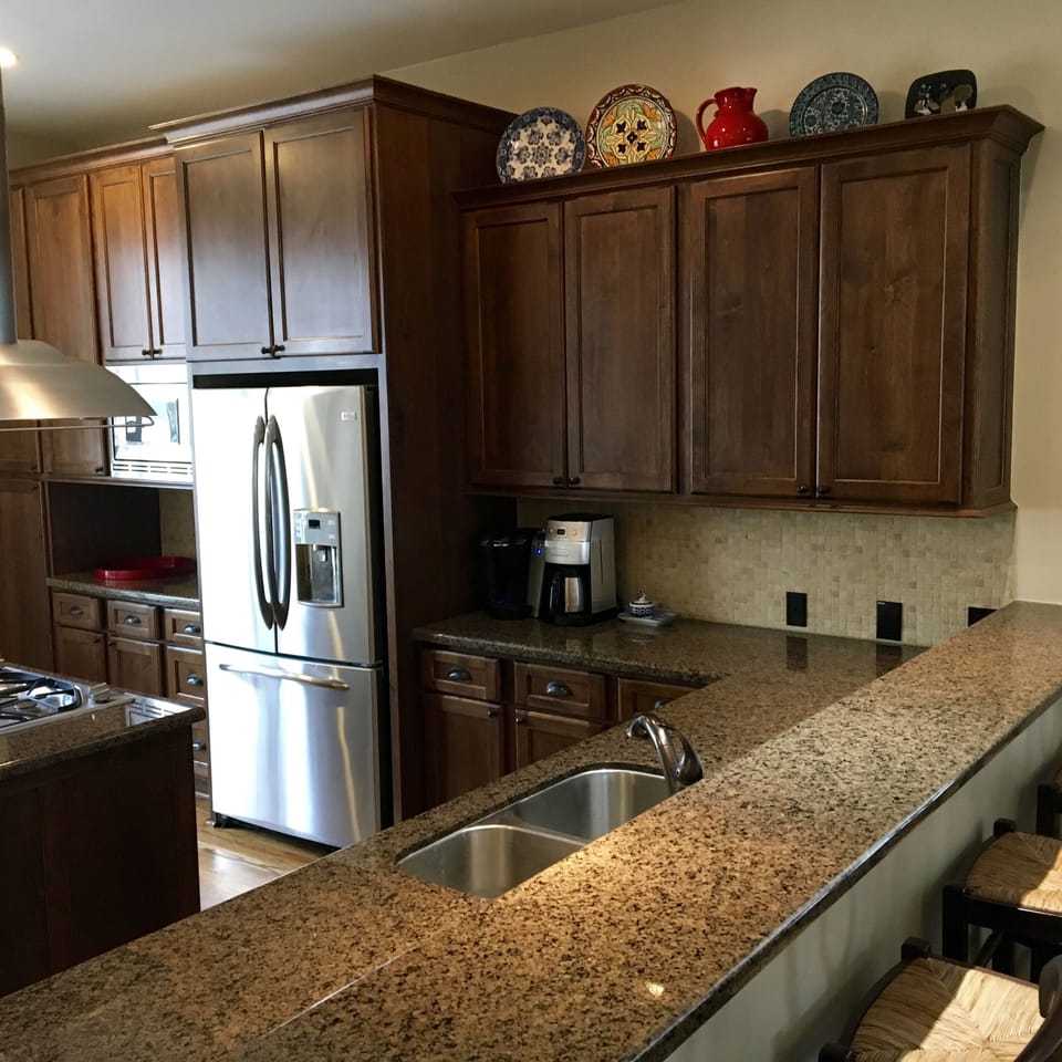 4 bar stools with kitchen view
