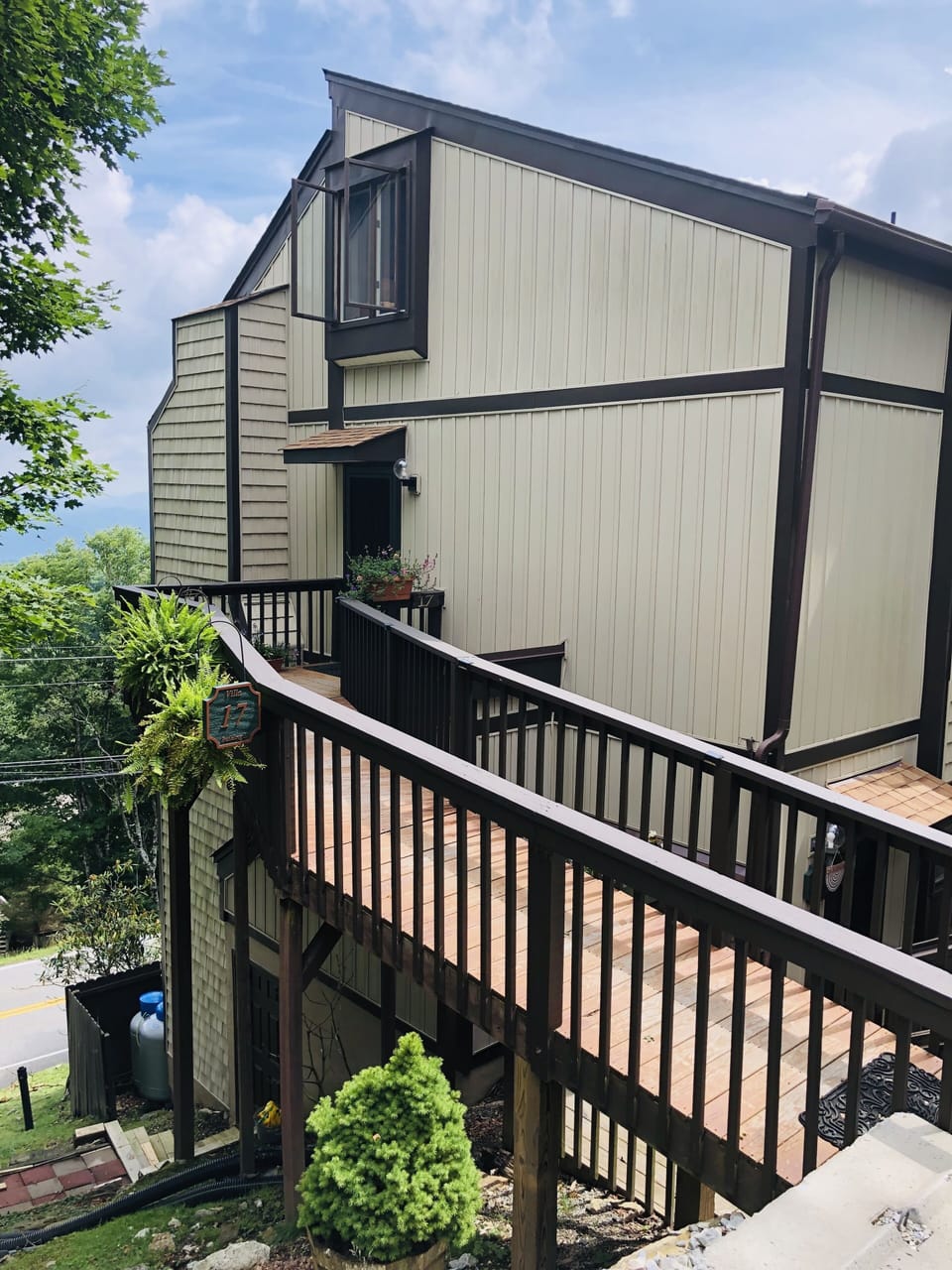 Upper unit with level entry ramp from service driveway.