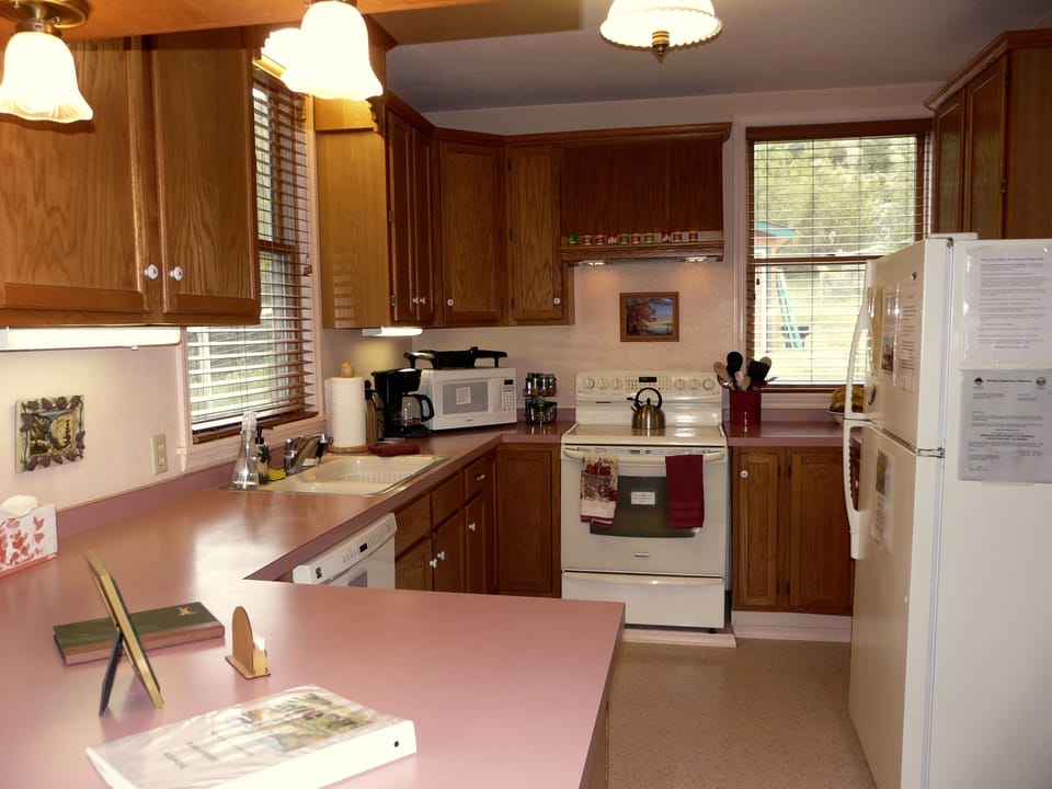 Kitchen features glass top range, a quiet dishwasher and new blinds