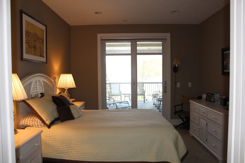 Master bedroom has sliding glass door access to patio/balcony