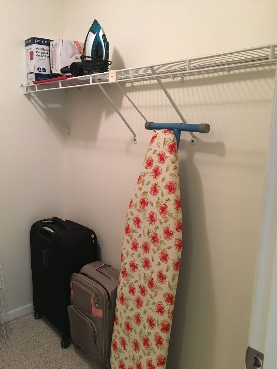 Walk in closet has Iron and Board, hair dryer, extra blankets and pillows.