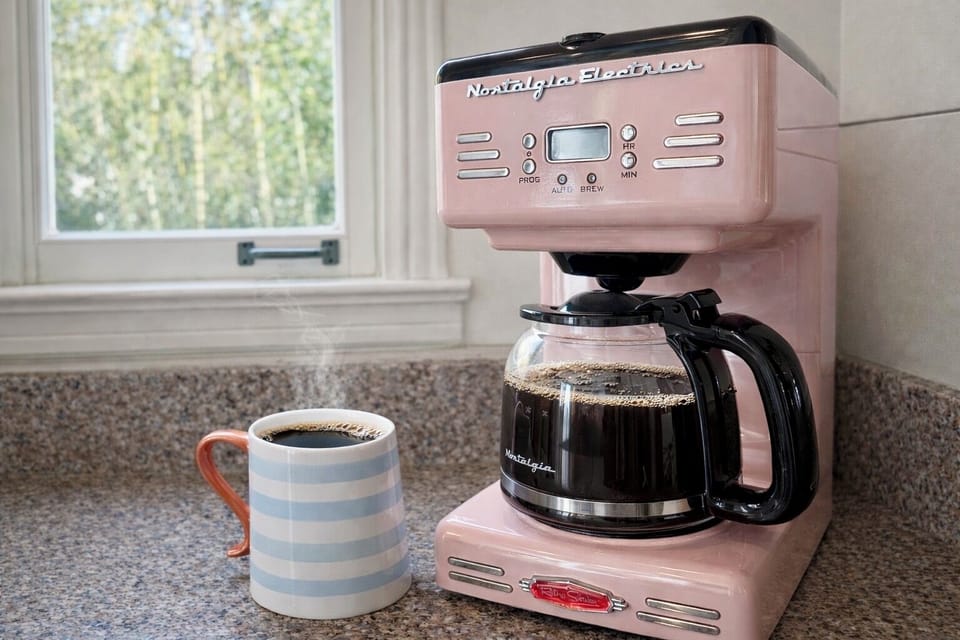 I provide a Keurig, French press, & this Nostalgia Electrics retro coffee maker.