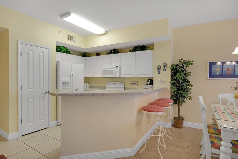 Kitchen view with pantry for supplies