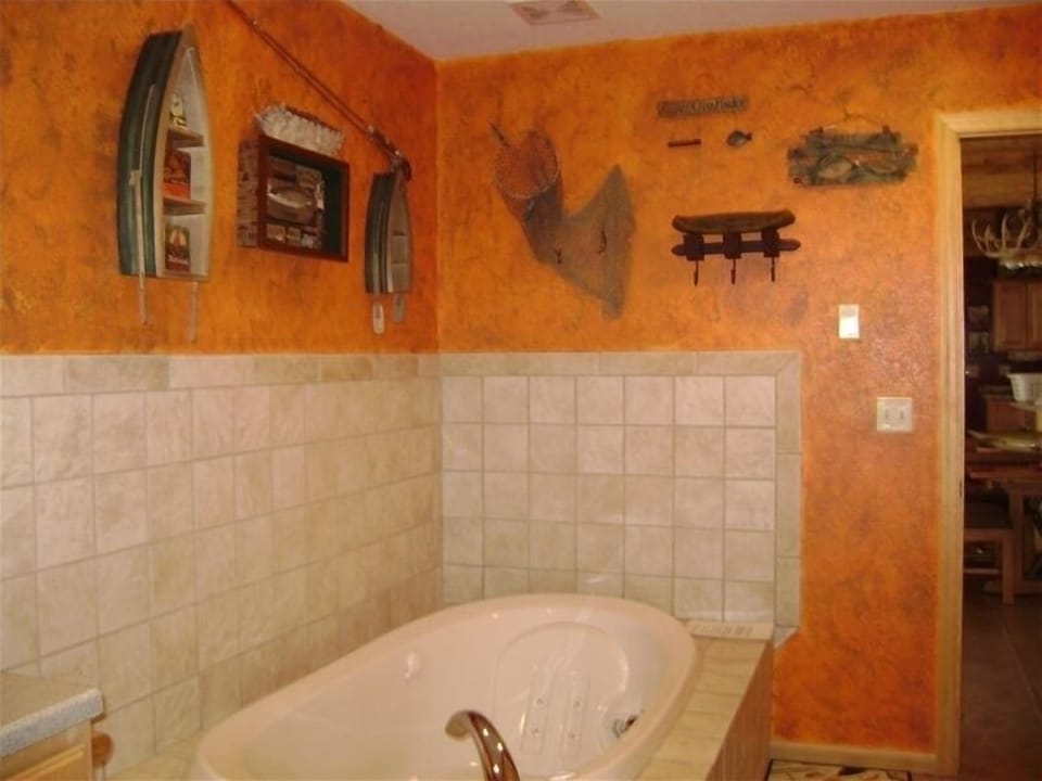 Upstairs bathroom with luxurious whirlpool bathtub and shower.