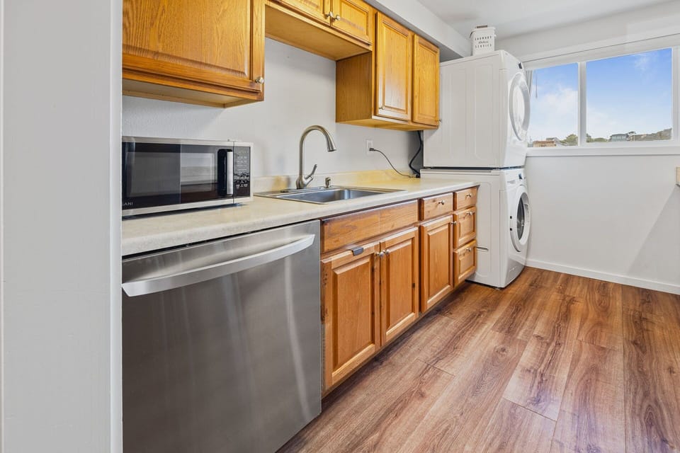 Stack washer/dryer available in the kitchen.