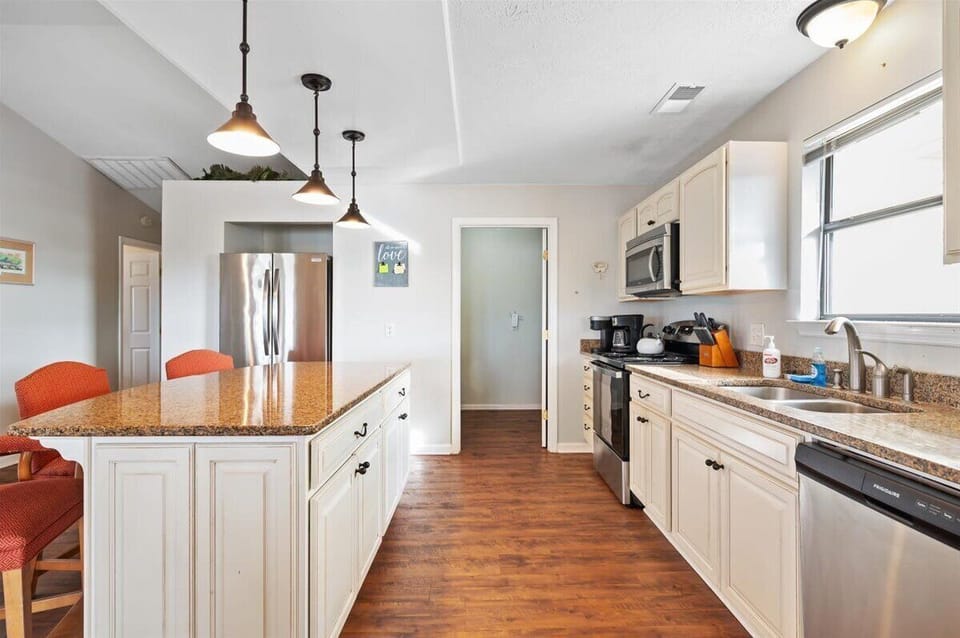 Kitchen island.   All stainless steel applicances.