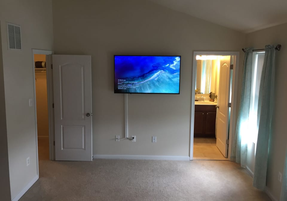 Master bedroom large-screen TV with cable