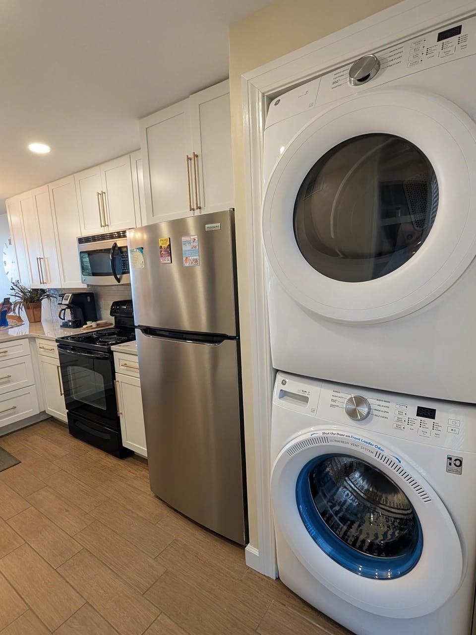 Modern kitchen with convenient stacked washer and dryer