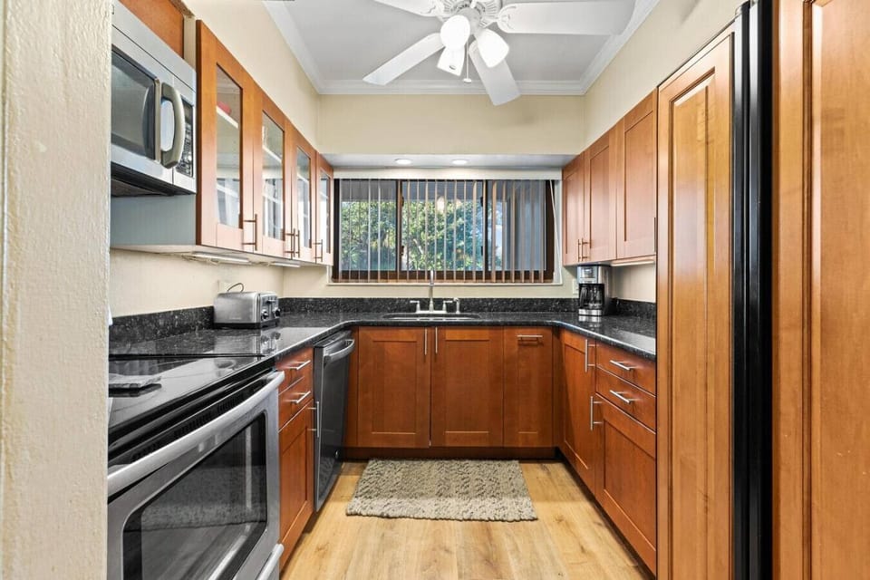 Kitchen has granite counter tops. A beautiful setting to prepare meals.