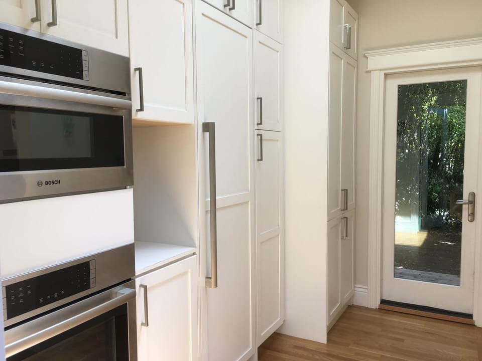 Pantry with Bosch double ovens, washer and dryer and easy access to Webber BBQ