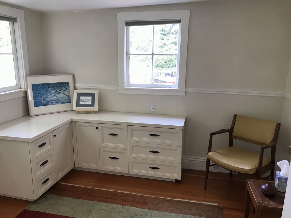 Bedroom II: spacious dresser and cozy seating area
