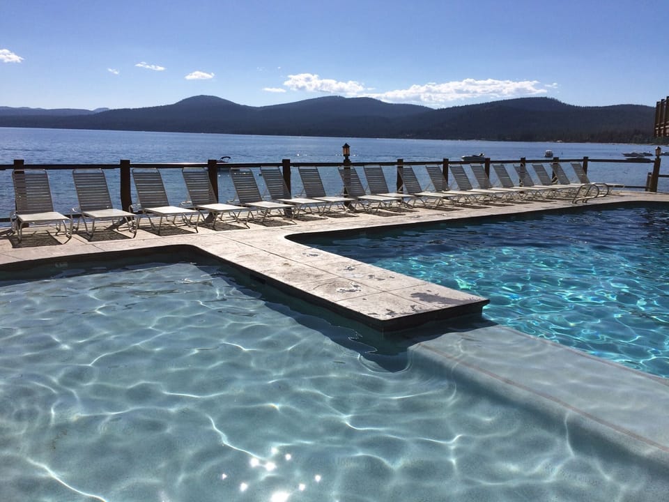 Condo pool ON THE LAKE! Heated all year long. Has bathrooms and sauna too.