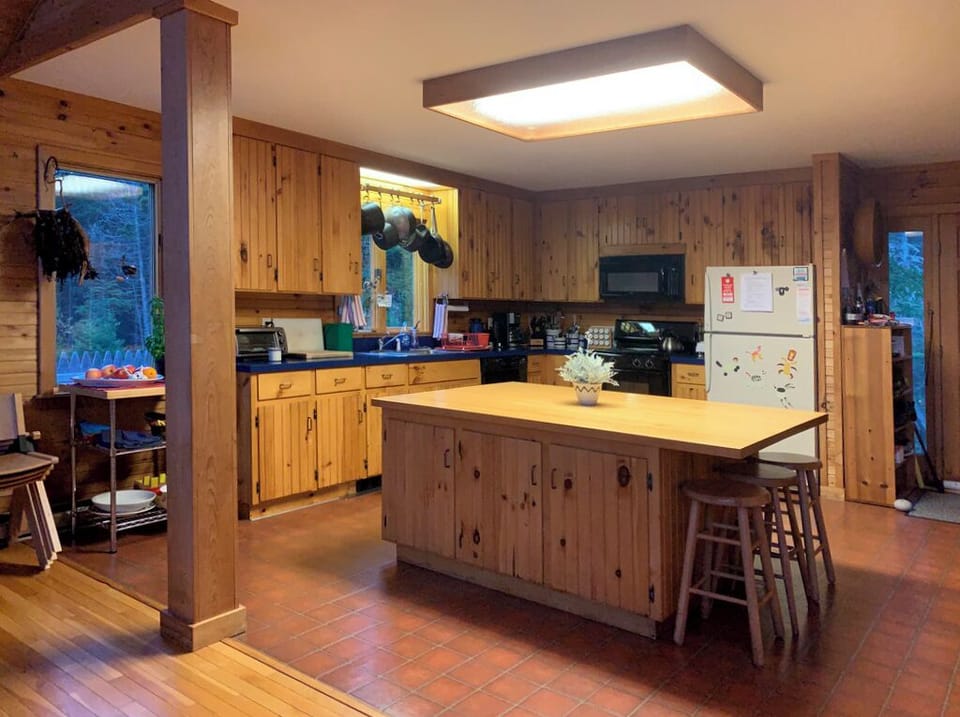 well appointed kitchen with good pot, pans, china