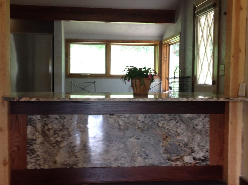 Sitting Bar looking into Kitchen and Dining Area