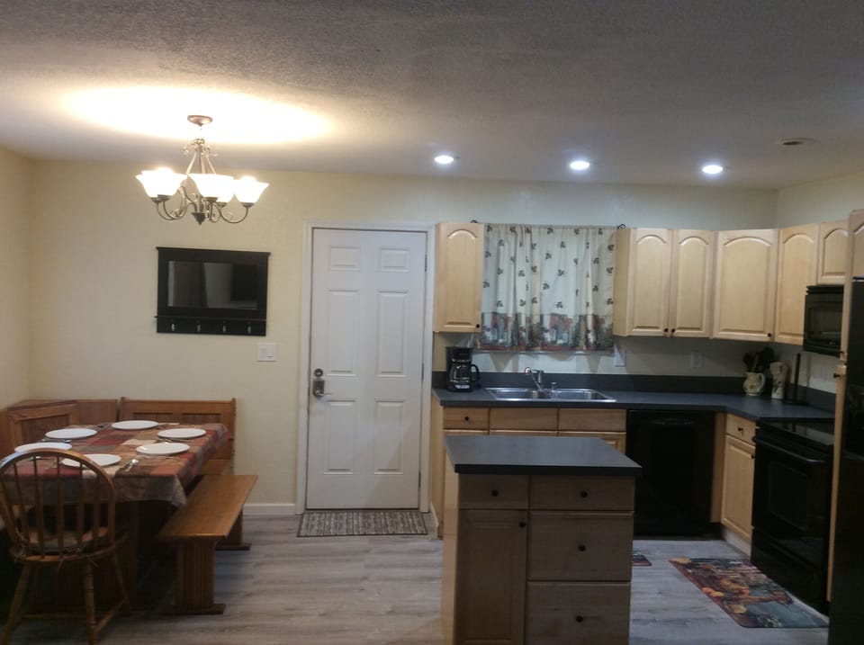 Open concept kitchen, dining and living room.