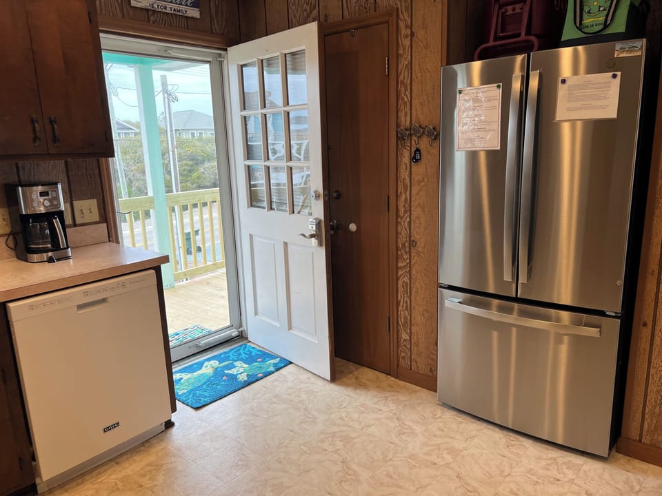 Dishwasher and french door fridge with bottom freezer.