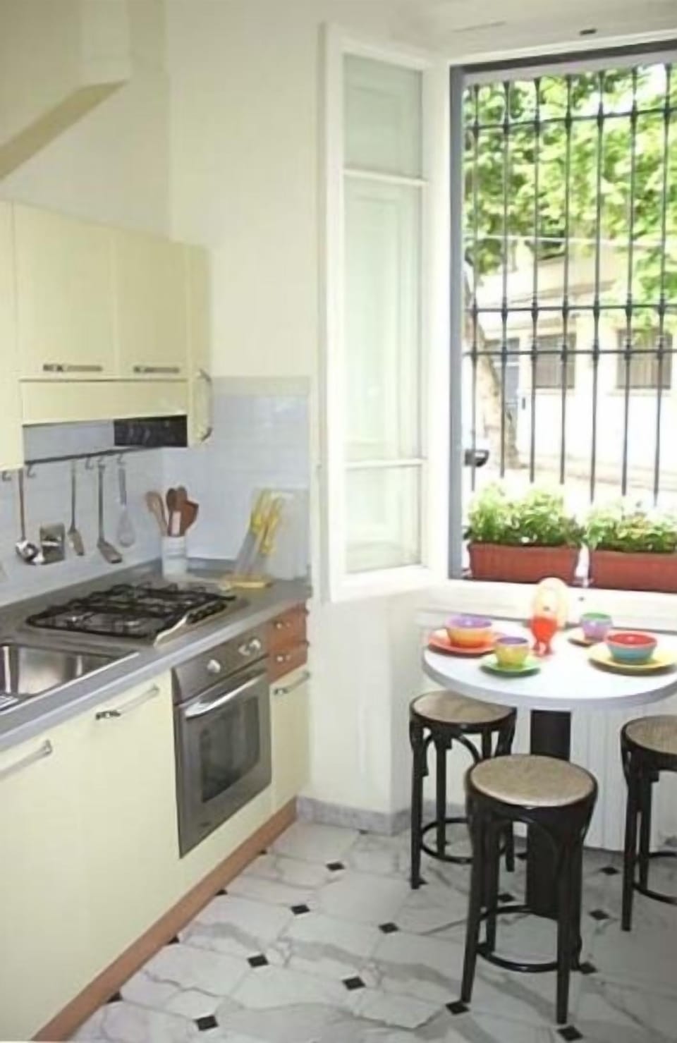 Kitchen - small but completely furnished; four burner stove, oven, lots of sun