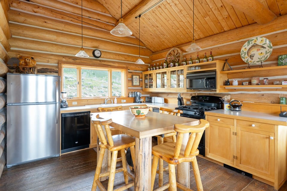 Fully stocked gourmet kitchen with propane gas range 