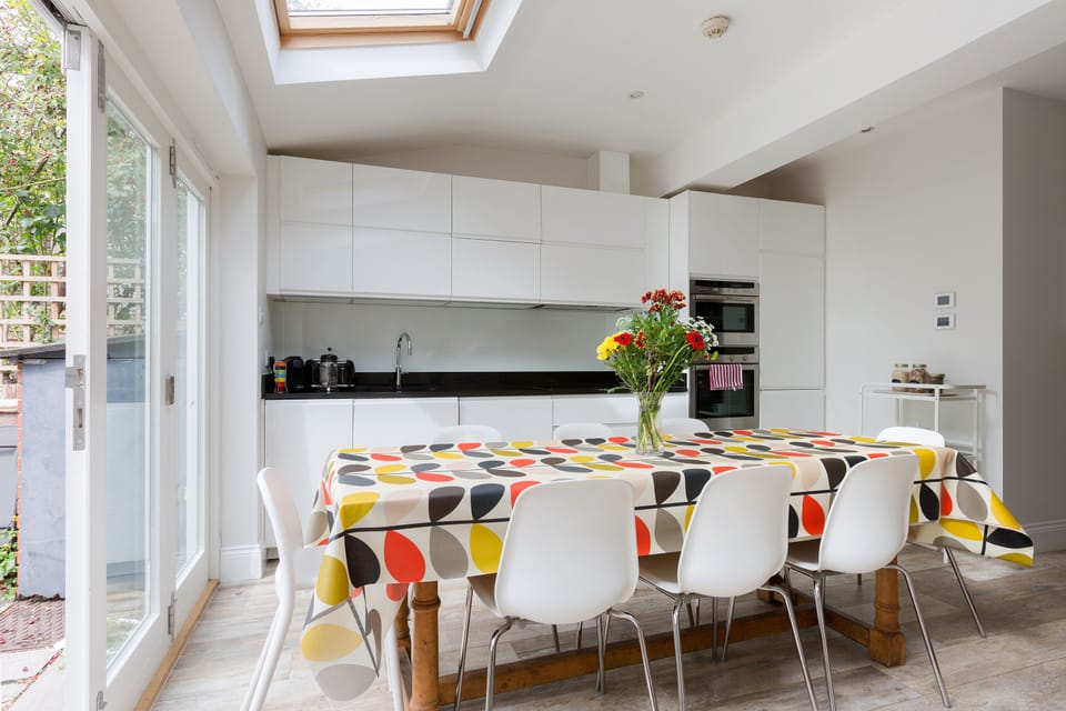Open plan kitchen/dining space with 
doors to the private patio garden.