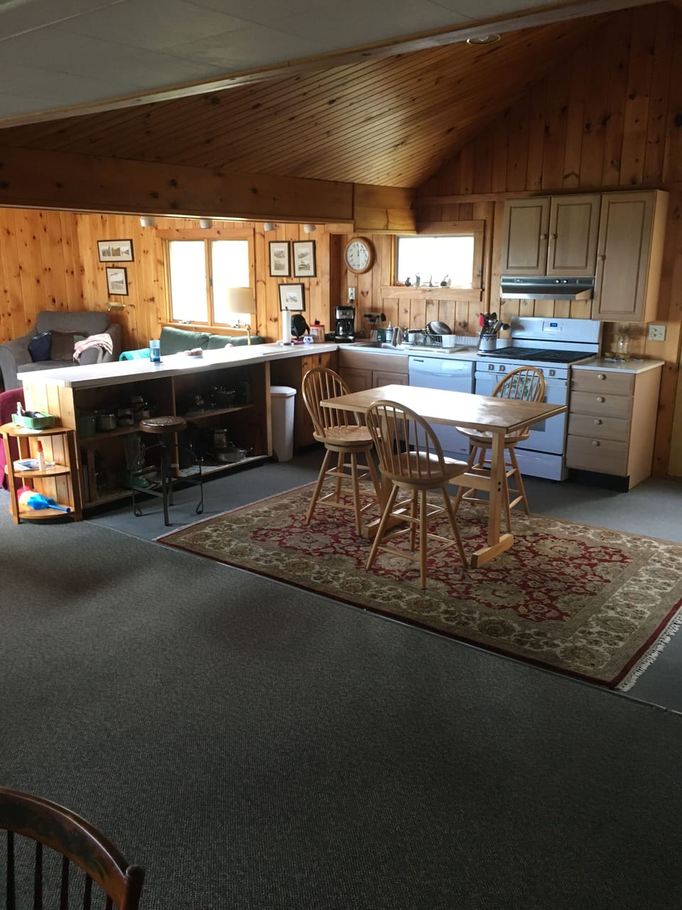 Kitchen in foreground.  TV room with WIFI in background.