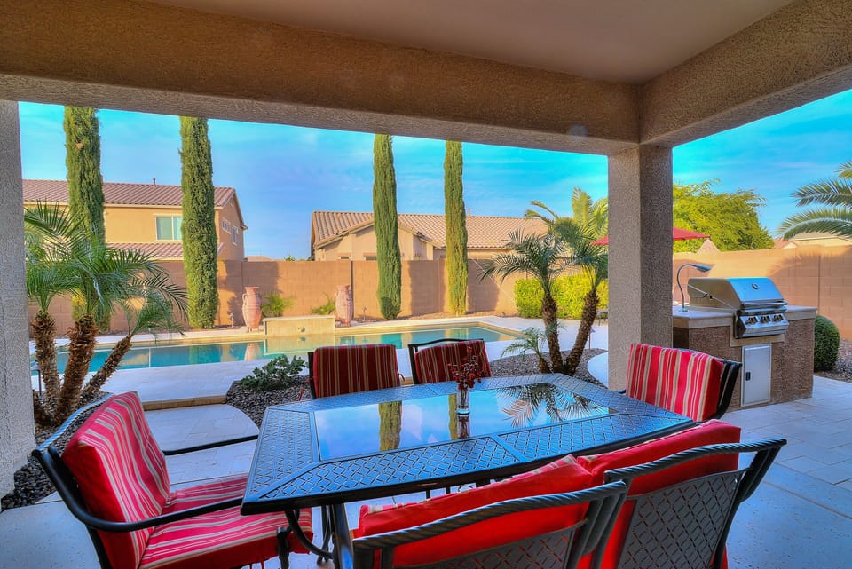 Covered patio dining and built-in BBQ overlooking your private pool oasis.
