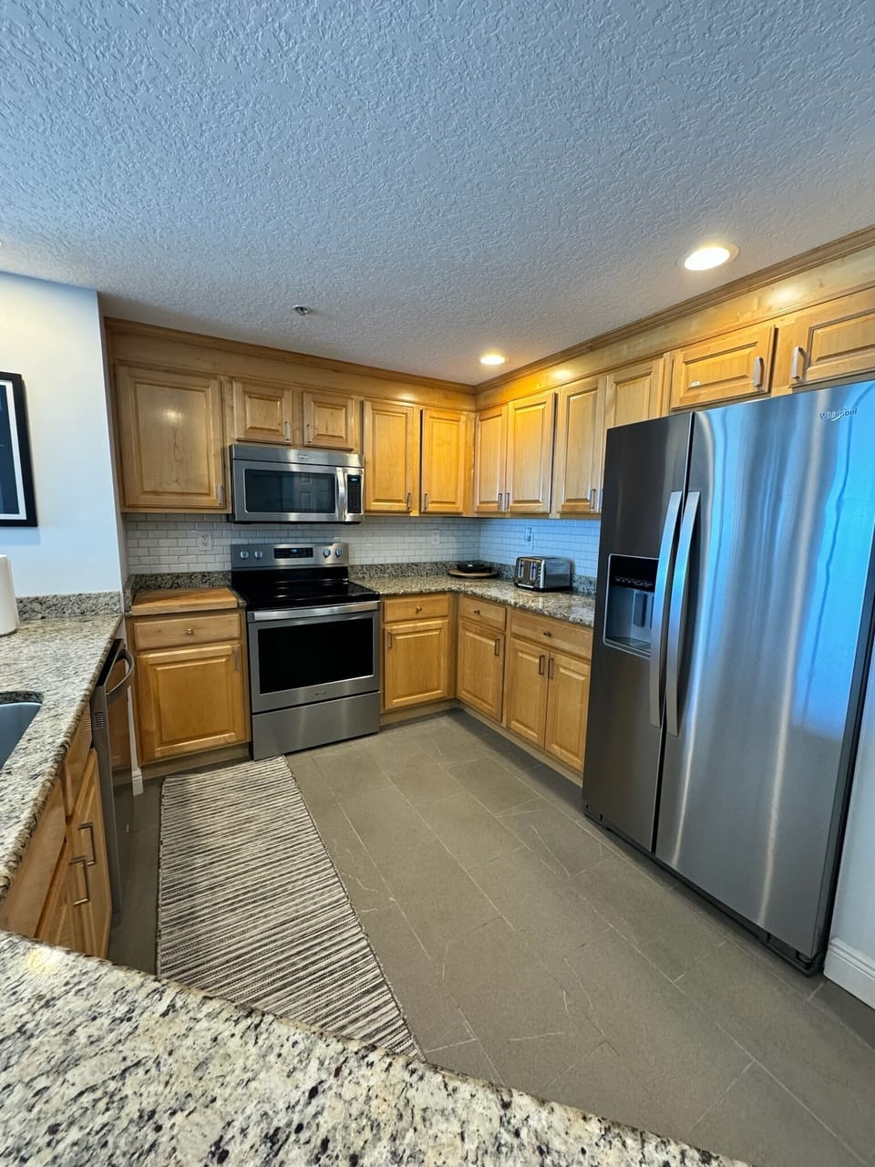 Fully equipped kitchen with recently updated appliances