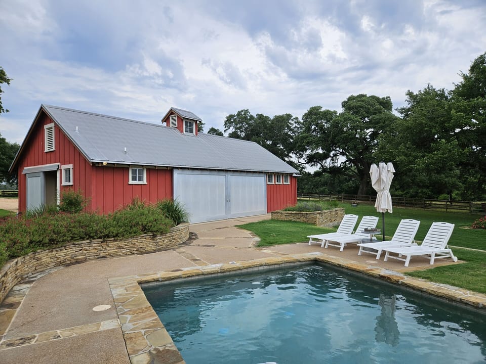 Pool View from bunkhouse/pavilion. Slide doors open for another area to enjoy.