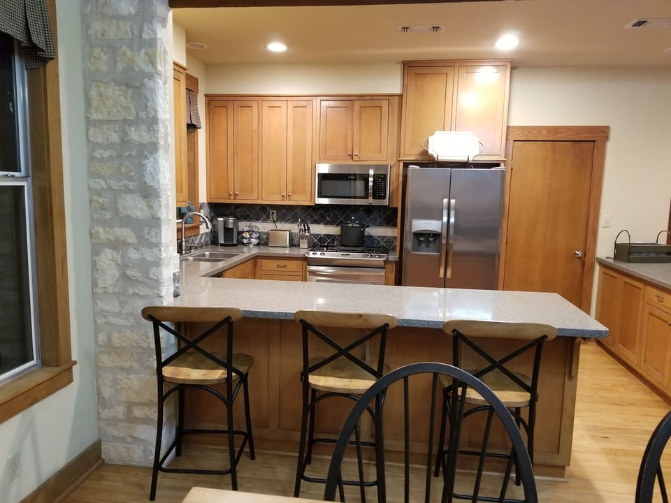 Kitchen entirely open  with island seating (3) to visit with the best at cooking