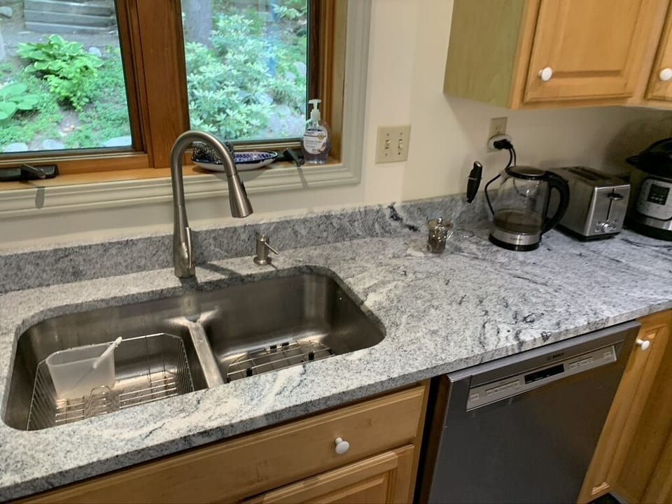 Kitchen sink with window view of patio
